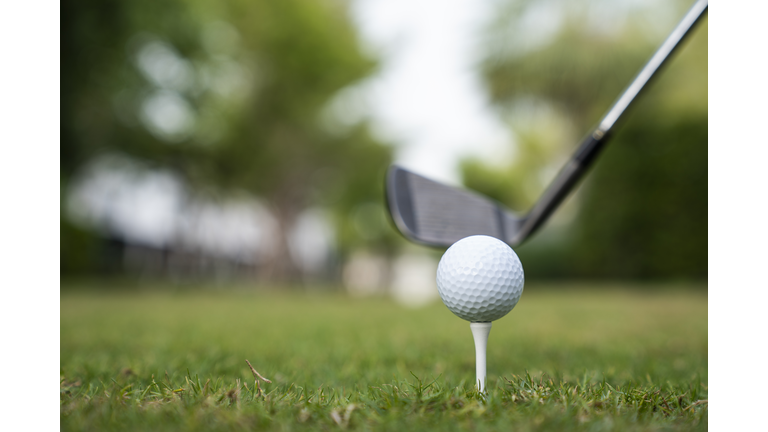 Golfer play golf in the golf field during sunset for business