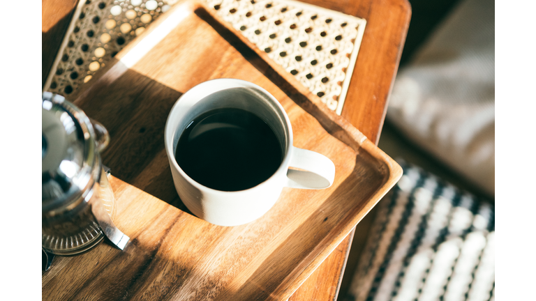 A Cup Of Coffee On The Serving Tray Under Sunlight