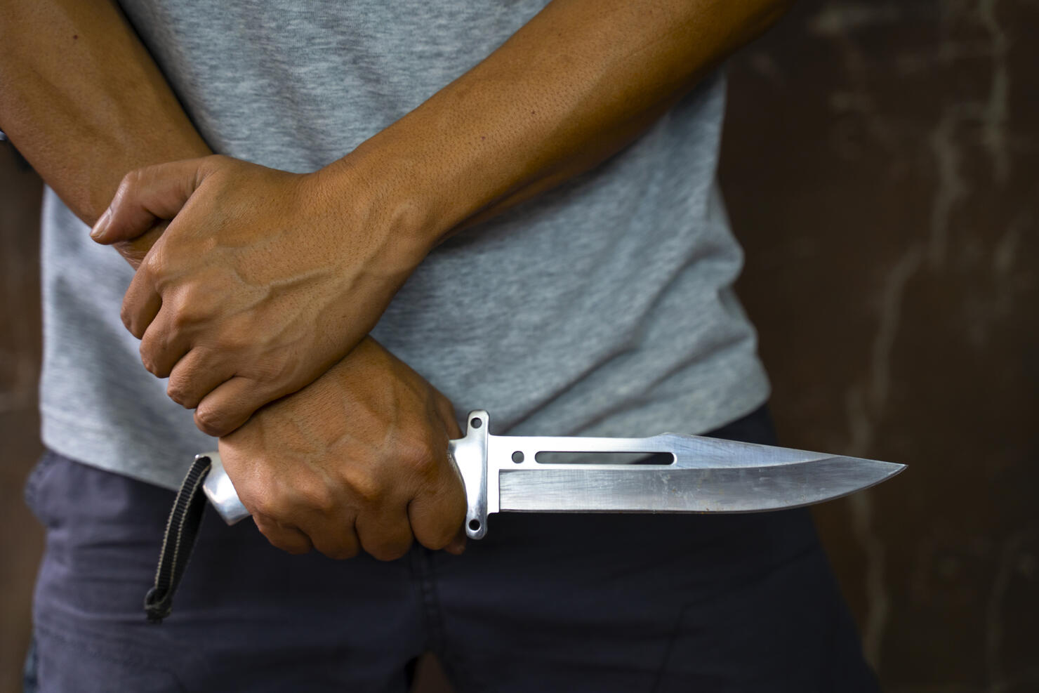 Criminal or bandit holding a knife.