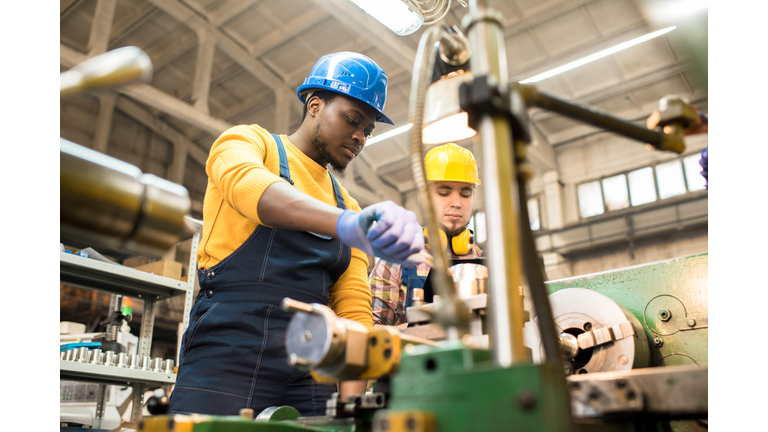 Lathe Operators Concentrated on Work
