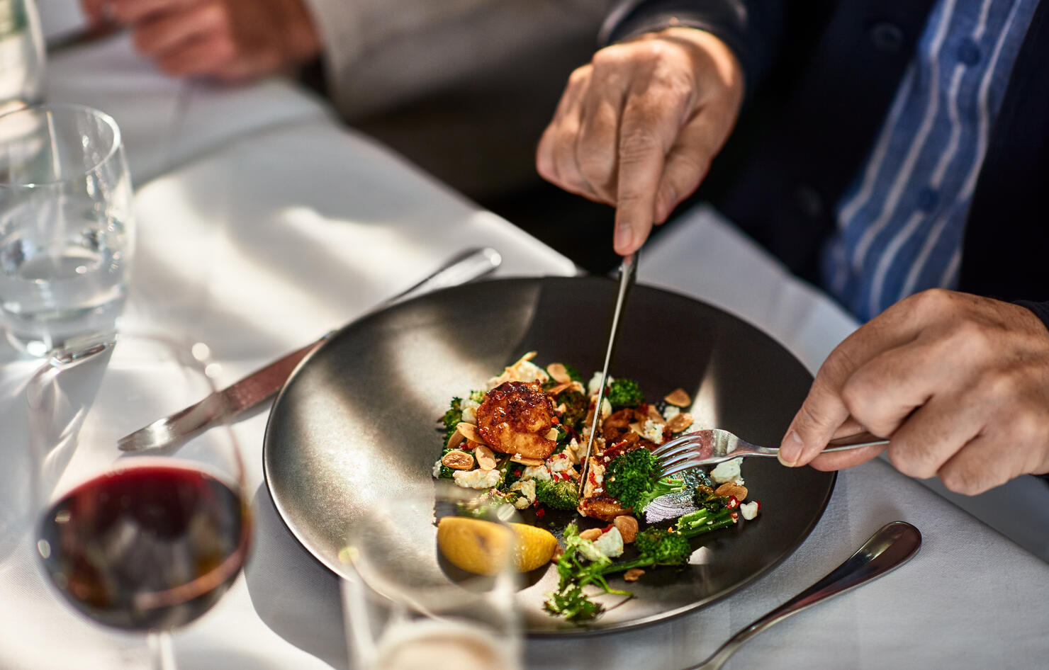 Man eating freshly prepared meal in restaurant