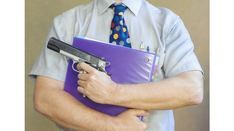 Teacher brings a loaded handgun to class