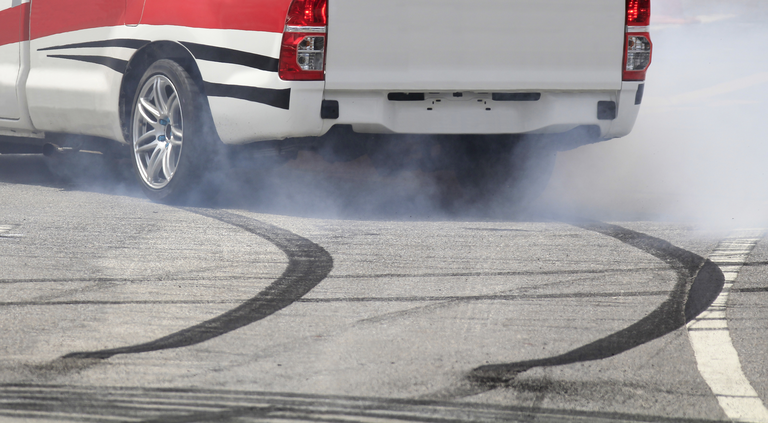 Emergency braking wheel with smoke on the highway.