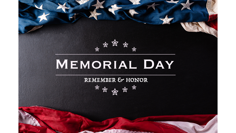 Happy Memorial Day. American flags with the text REMEMBER & HONOR against a black  background. May 25.