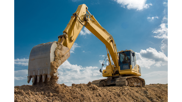 excavator blue sky heavy machine construction site