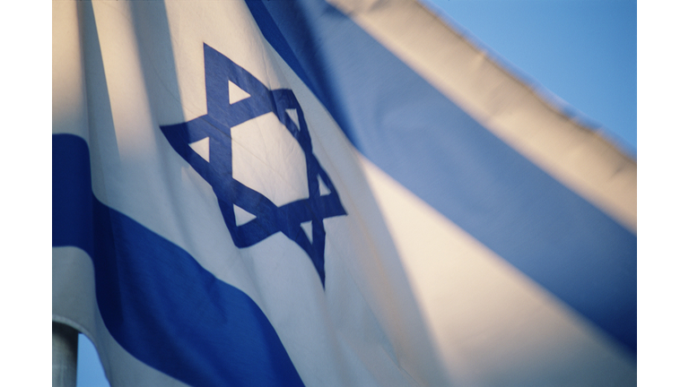 Flag of Israel with Star of David emblem, low angle view