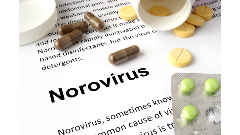 Paper with norovirus and pills.