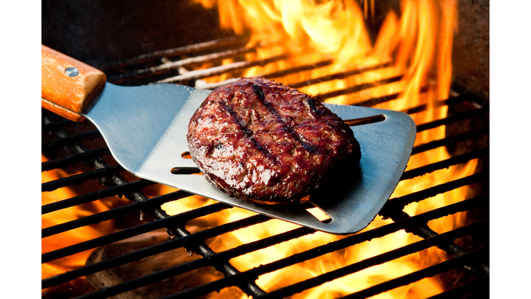Hamburger Patty on Grill with Fire