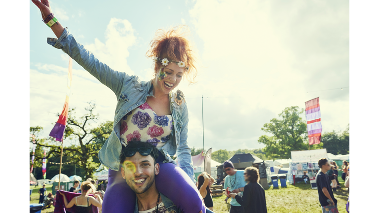 Group of friends having fun at a music festival