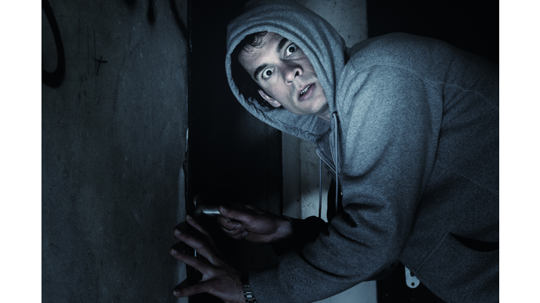 Burglar Man Outside House at Night