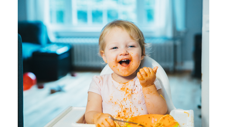 Portrait of a Cute Baby Enjoying Spaghetti Pasta