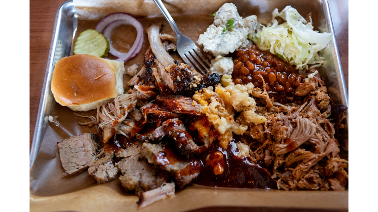 Above view of barbecue and sides on trays