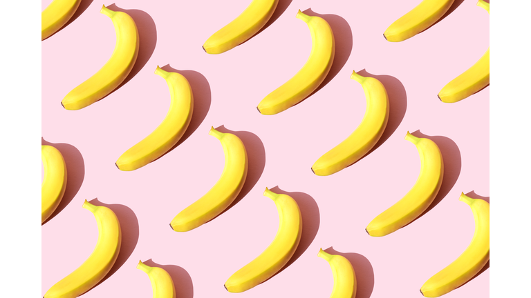 Repeated banana on the pink background