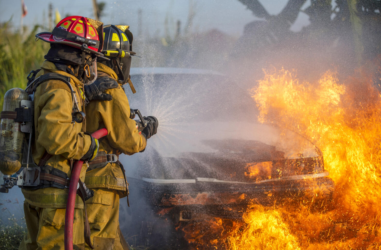 Firefighter in fire fighting operation.
