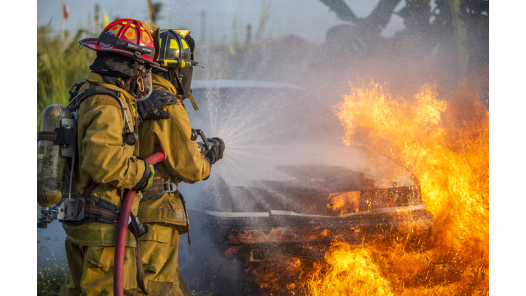 Firefighter in fire fighting operation.