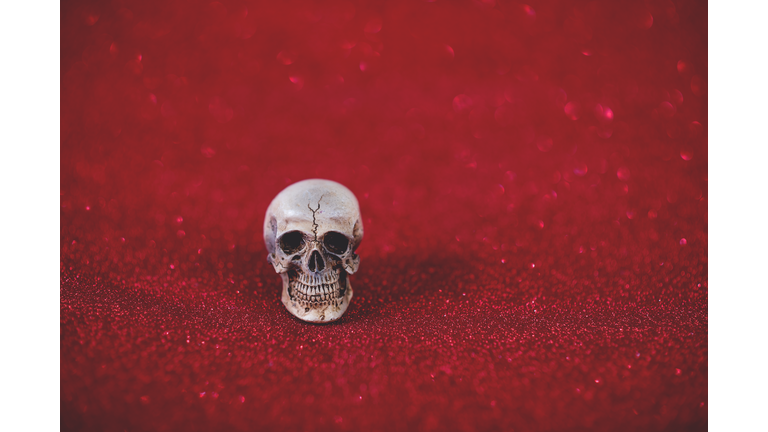 Close-Up Of Human Skull On Red Background