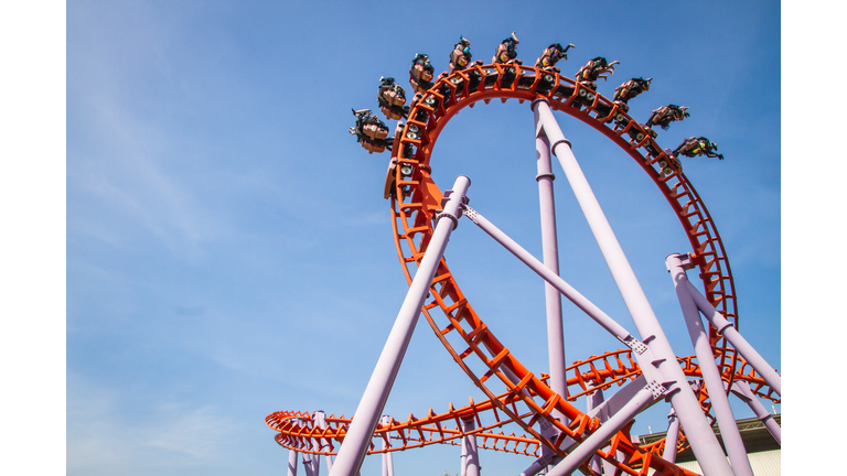 Rollercoaster against blue sky