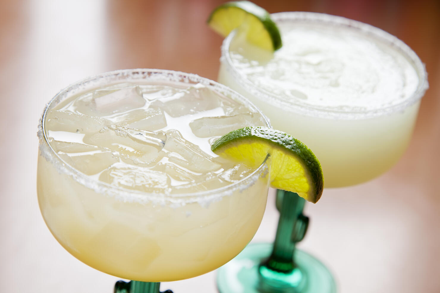 Two glasses of classic margarita: on the rocks and blended