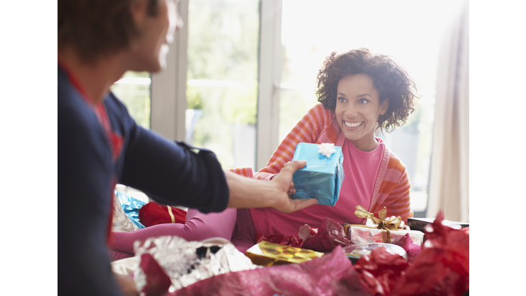 Man giving wife Christmas gift