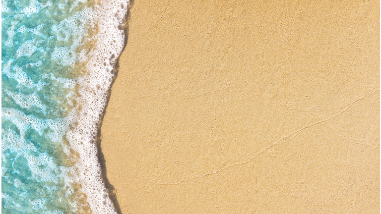Soft wave lapped on empty sandy beach, Summer Background.