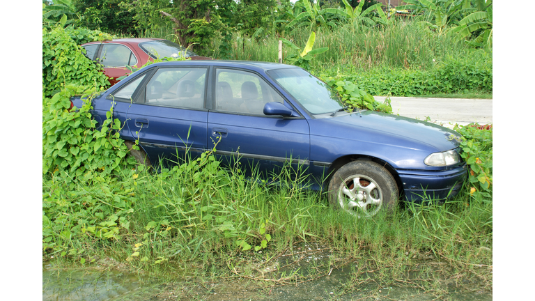 Old car parked for long time.