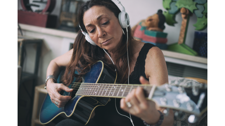 Woman playing guitar