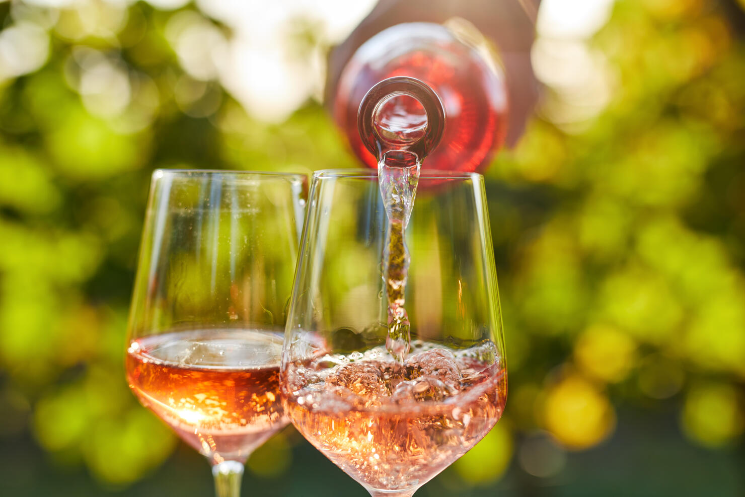 Pouring rose wine into a glass