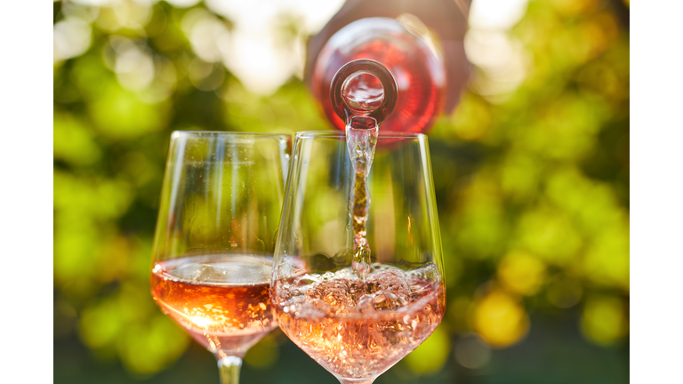 Pouring rose wine into a glass