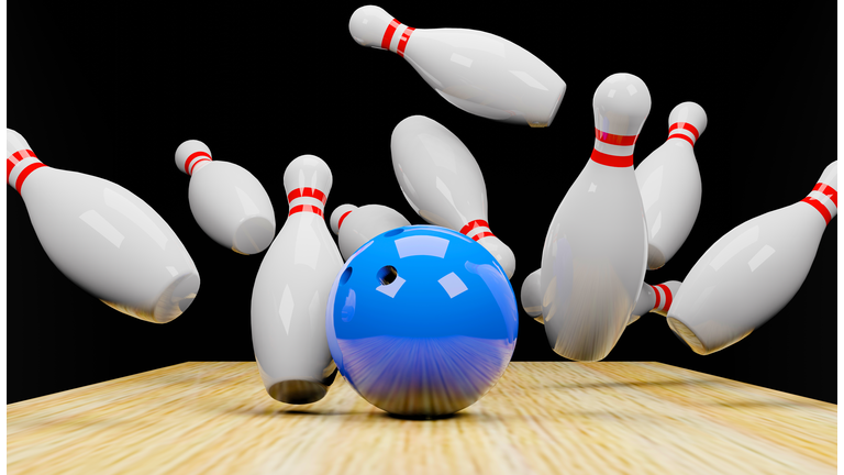 3d render of a bowling strike with skittles and a ball.Digital image illustration.