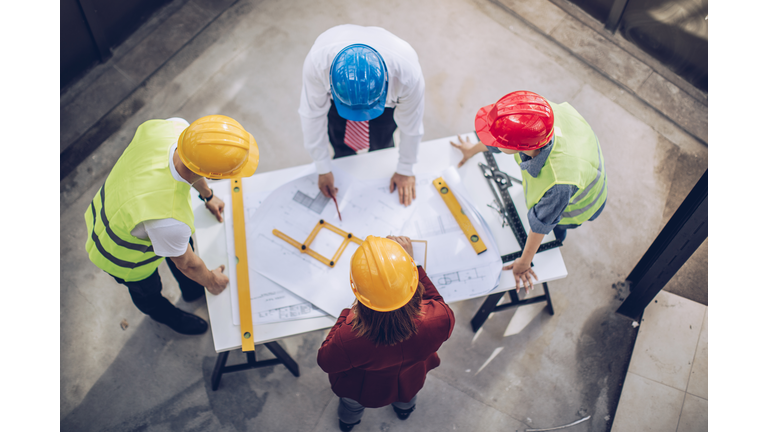 Architects working together at construction site