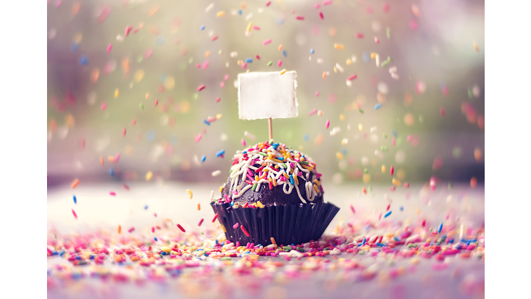 Chocolate truffle cake with falling sprinklers
