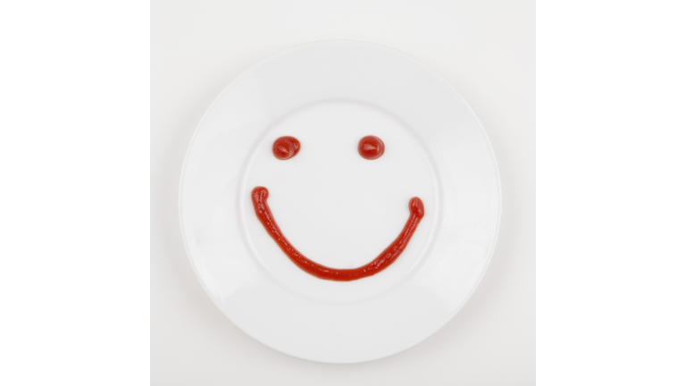 Plate with smiley face made of ketchup