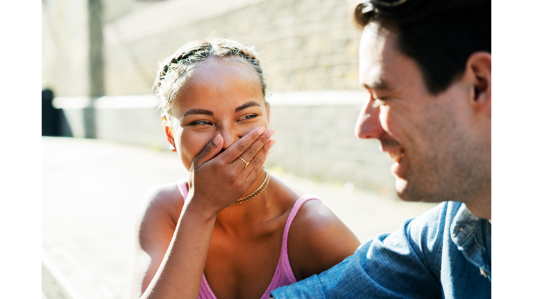 Two friends talking and laughing