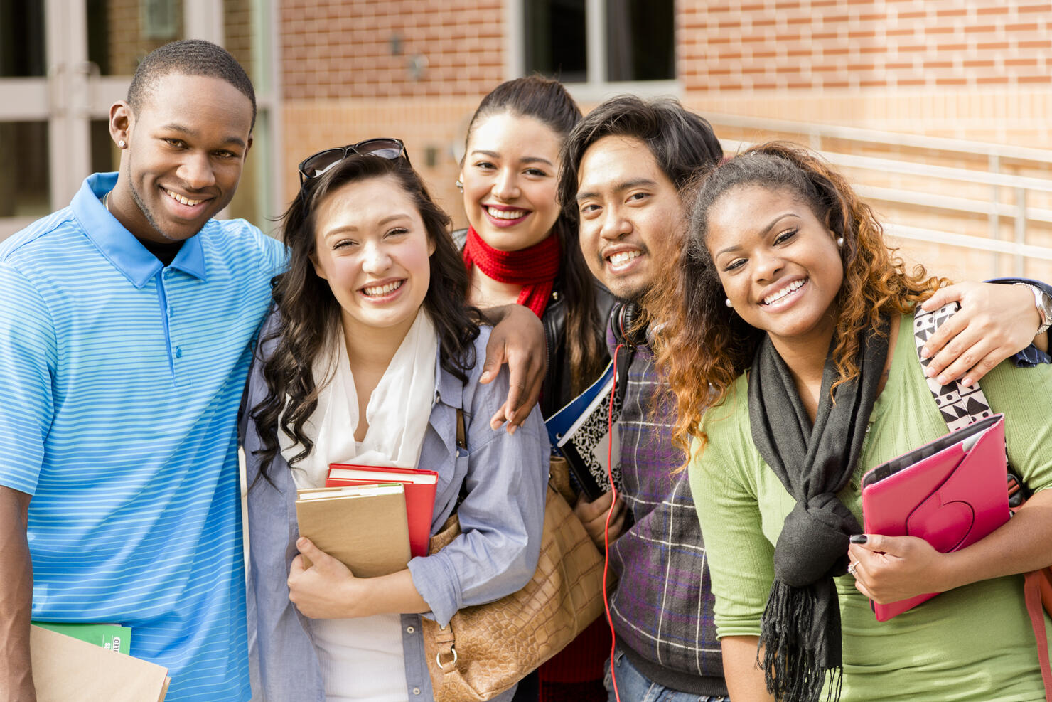 Education: Multi-ethnic college friends hang out before class.