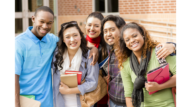 Education: Multi-ethnic college friends hang out before class.