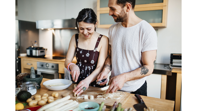 Mature couple preparing food for dinner