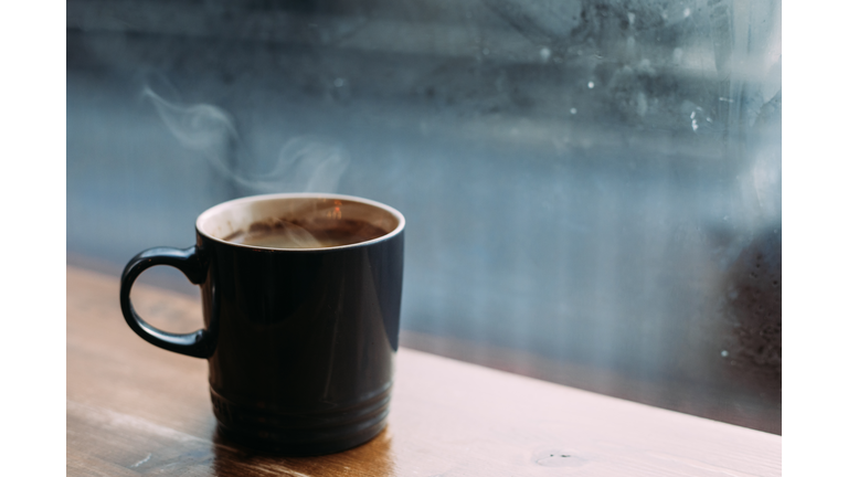 Cup of coffee at a cafe in cold weather