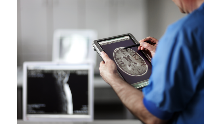 Doctor holding portable computer