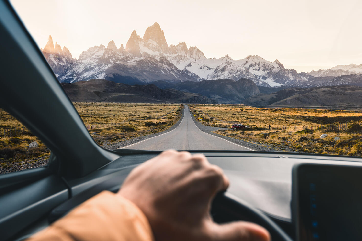 Personal perspective of man driving a car in Patagonia, Argentina