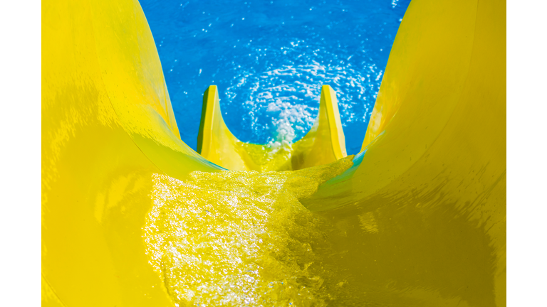 High Angle View Of Yellow Slide At Water Park