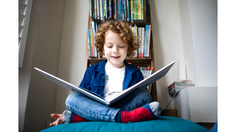 5 year old kid reading a book