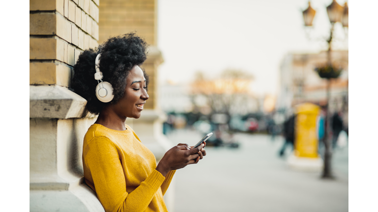 Young woman listening music