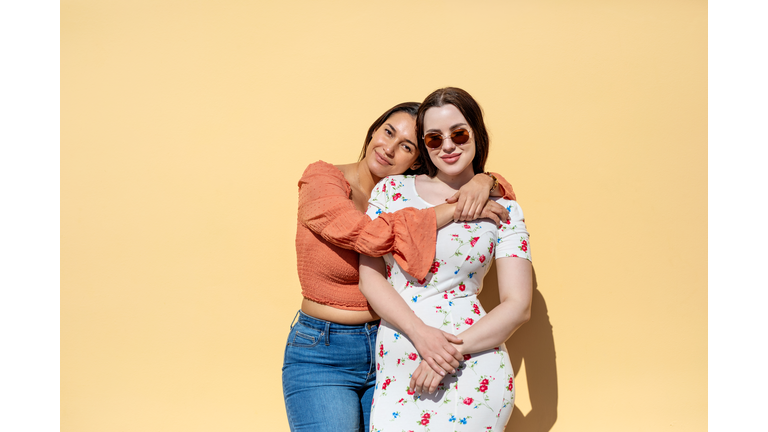 Portrait of beautiful female friends standing together