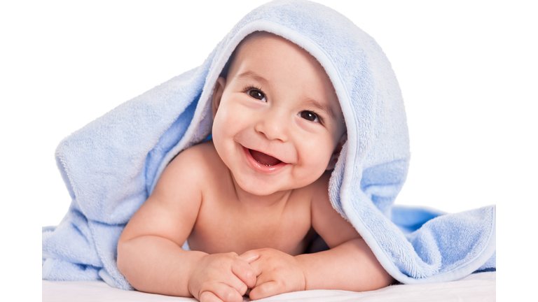 Beautiful smiling baby child after shower isolated on white