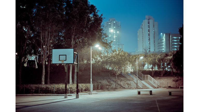 Street basketball court at night