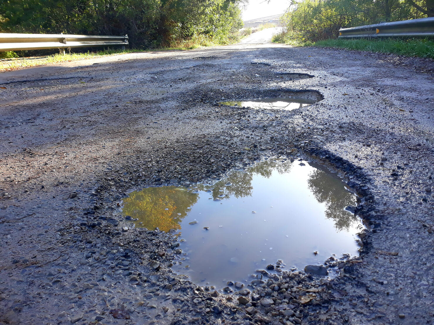 Potholes In The Middle Of A Mountain Road