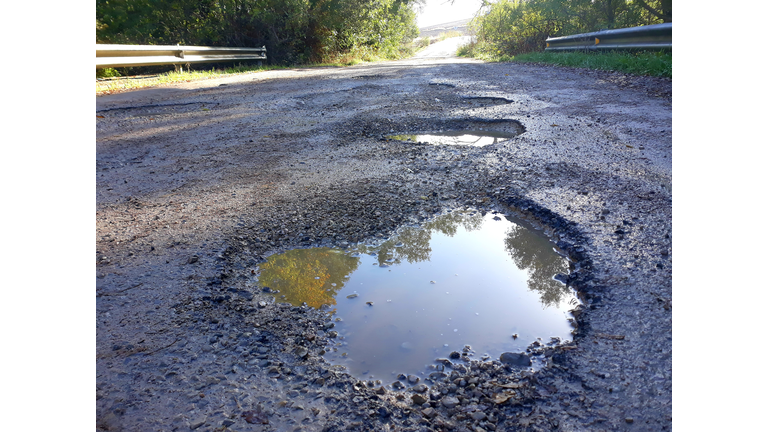 Potholes In The Middle Of A Mountain Road