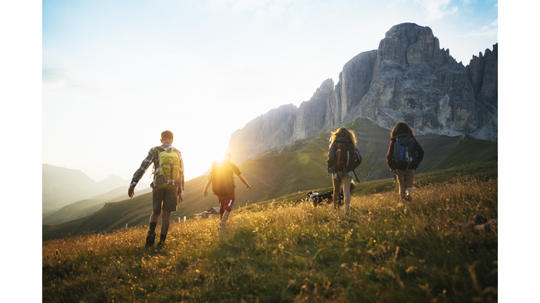 Adventures on the Dolomites: teenagers hiking with dog