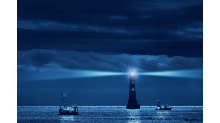 lighthouse and ships in the night