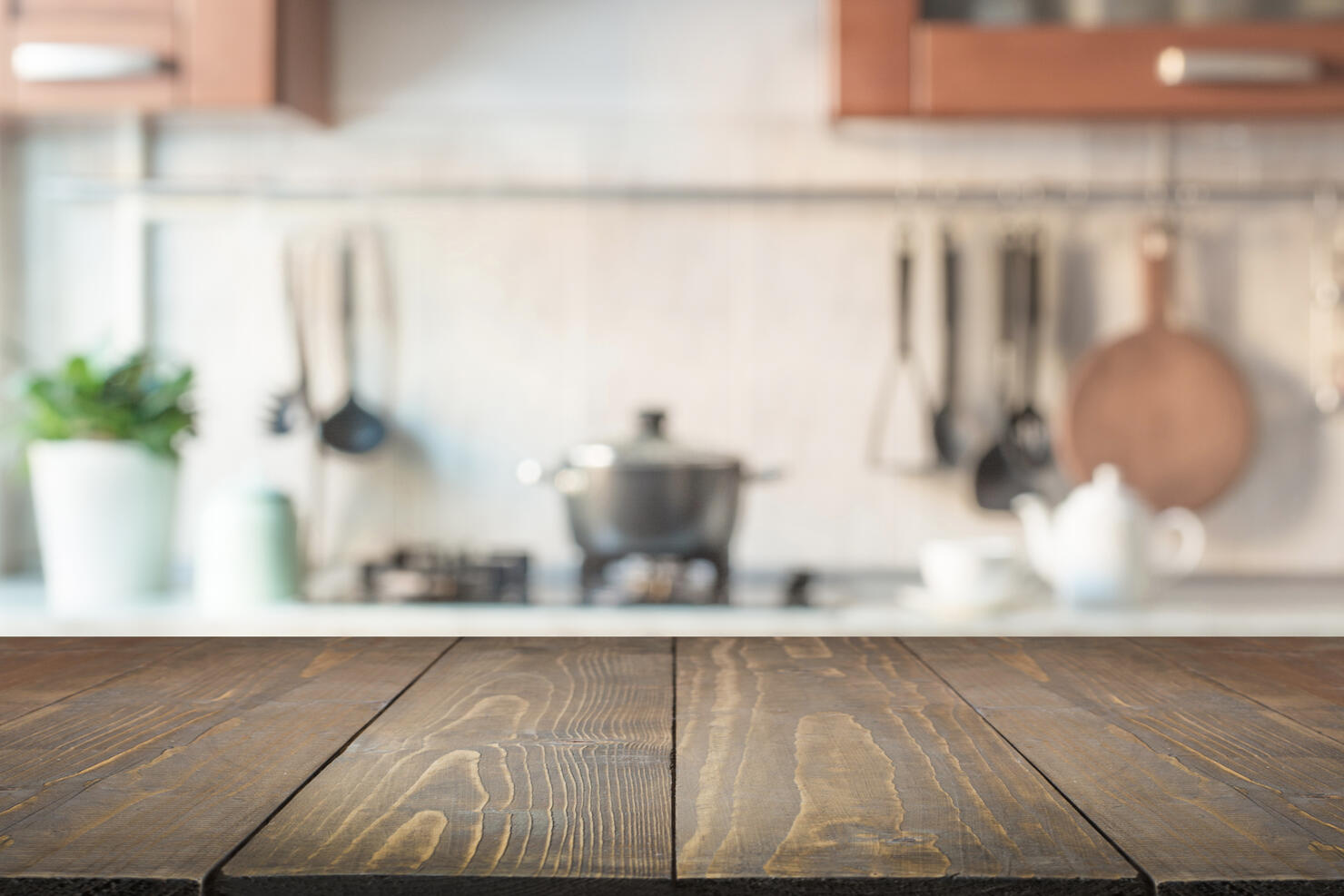 Blurred abstract background. Modern kitchen with tabletop and space for display your products.